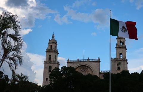 flag and building in yucatan mexico